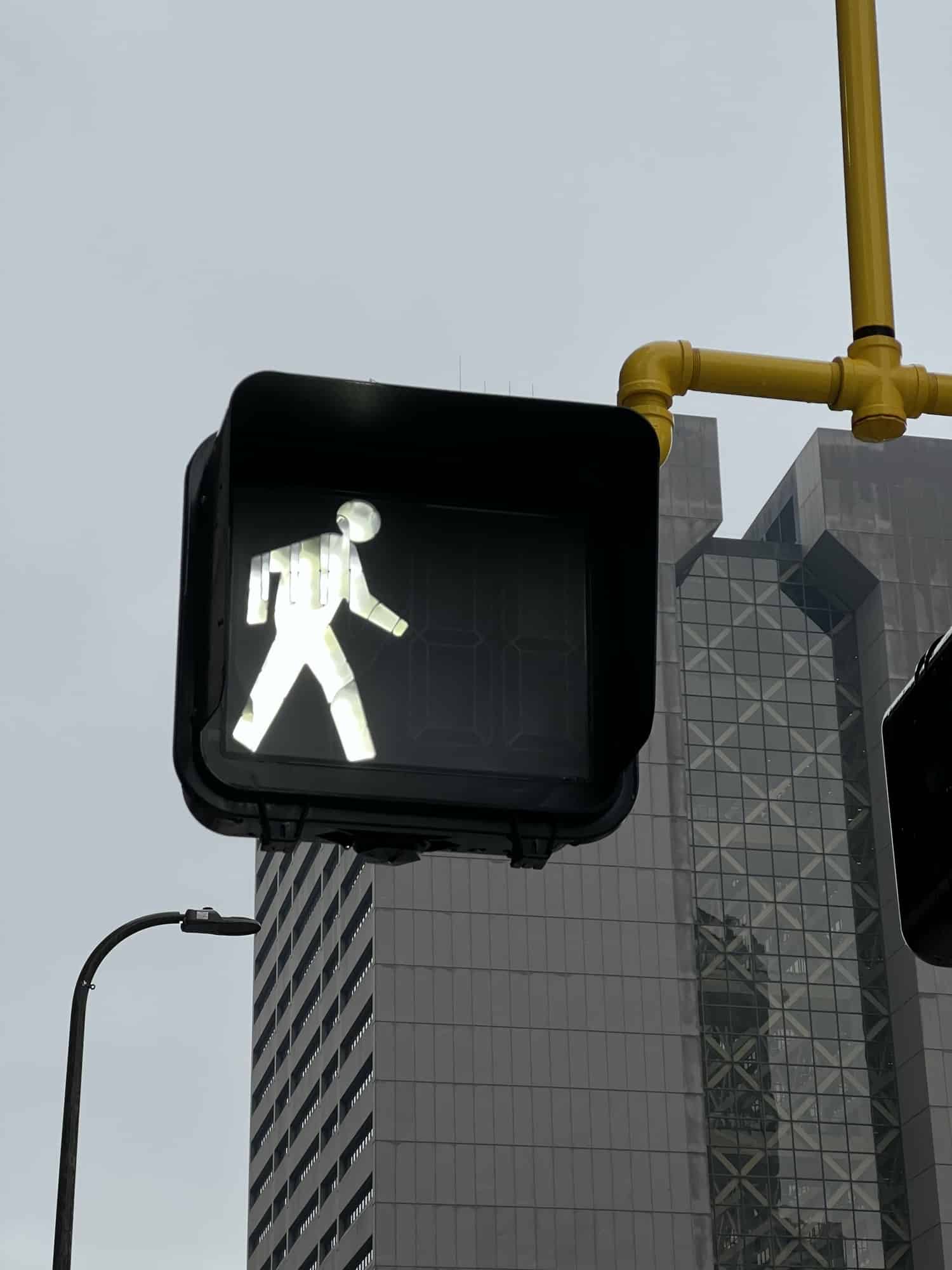 Closeup shot of a pedestrian crossing sign